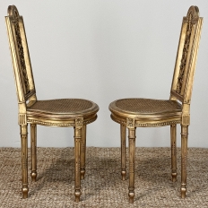 Pair 19th Century French Giltwood Louis XVI Salon Chairs with Cane Seats